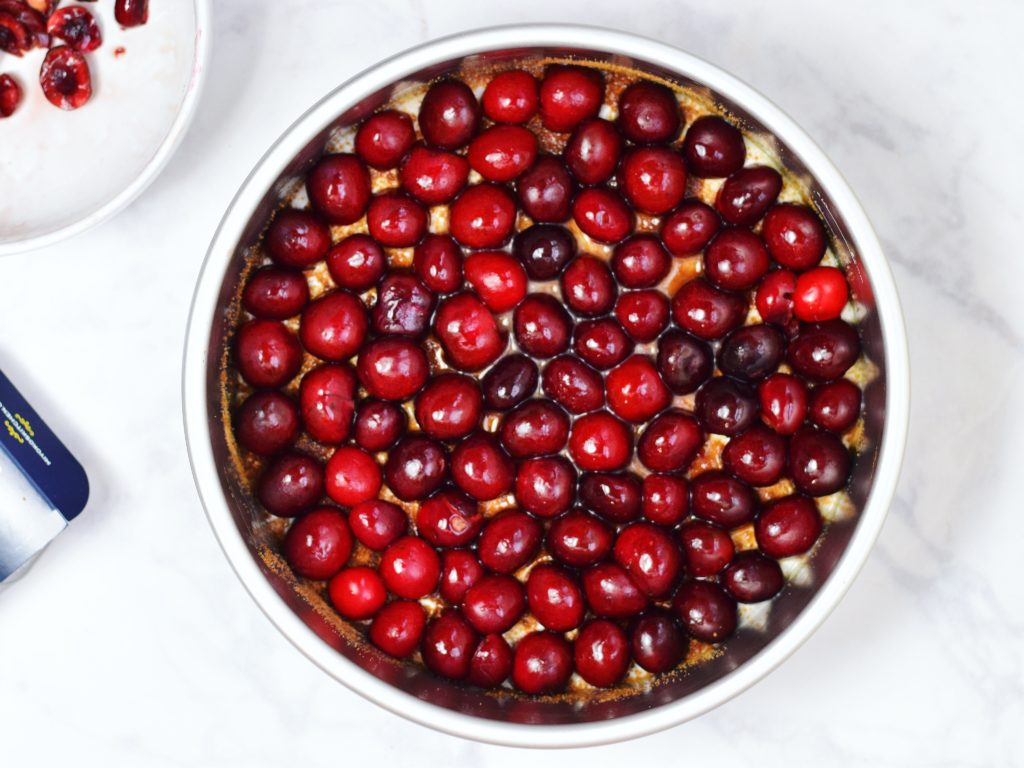 Cherries for Olive Oil Upside Down Cake Arranged in Pan
