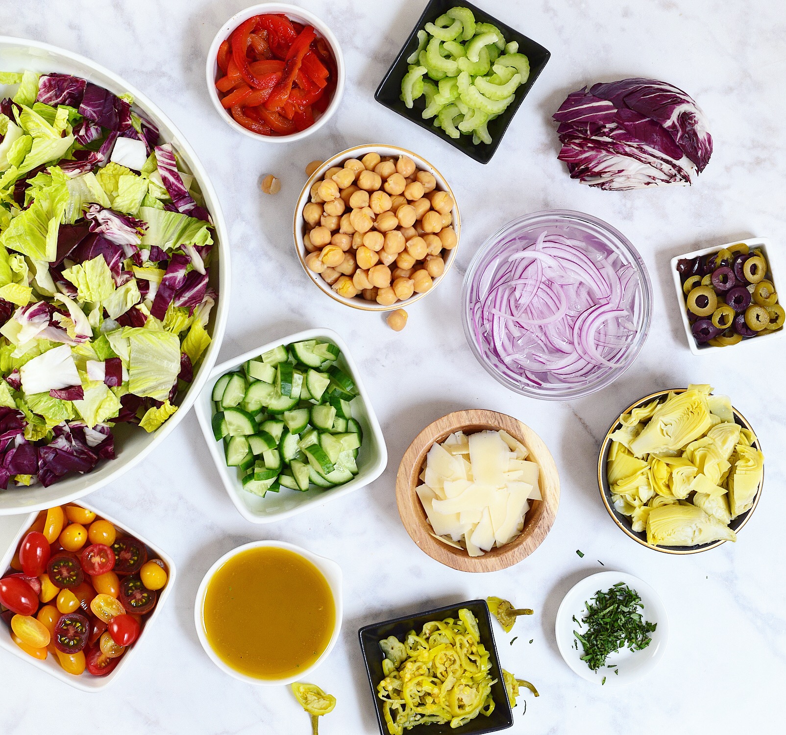 https://goodhealthgourmet.com/wp-content/uploads/2019/05/Vegan-Classic-Italian-Chopped-Salad-Mise.jpg