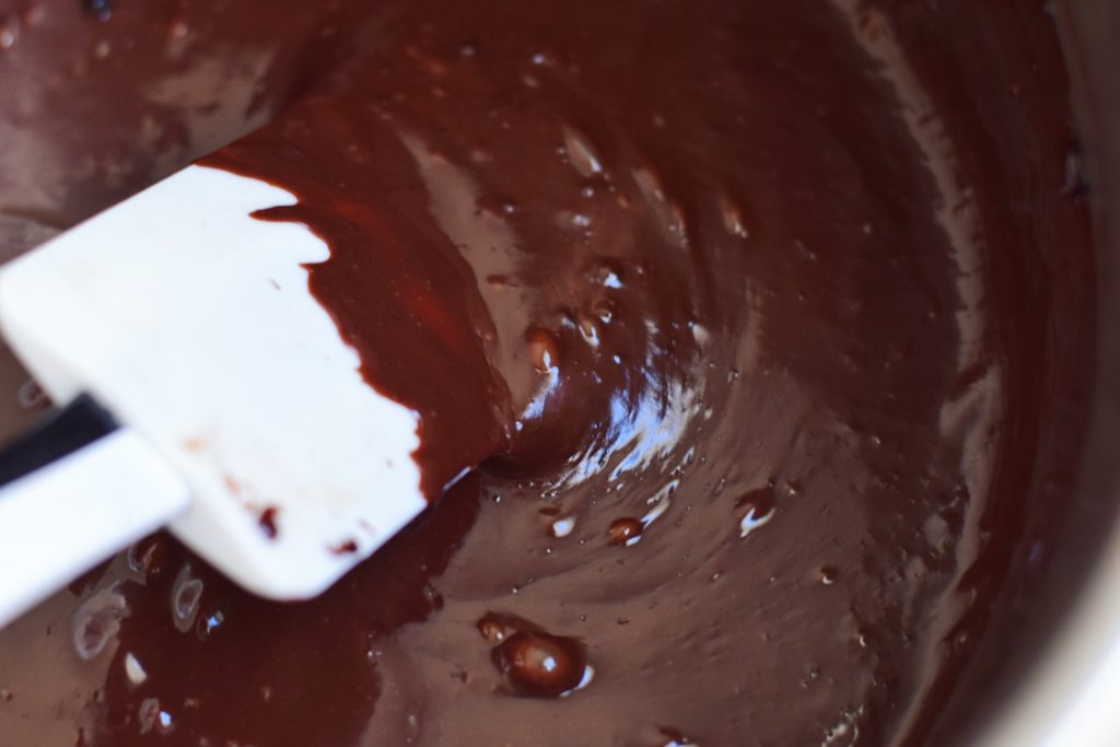 stirring vegan dark chocolate pudding